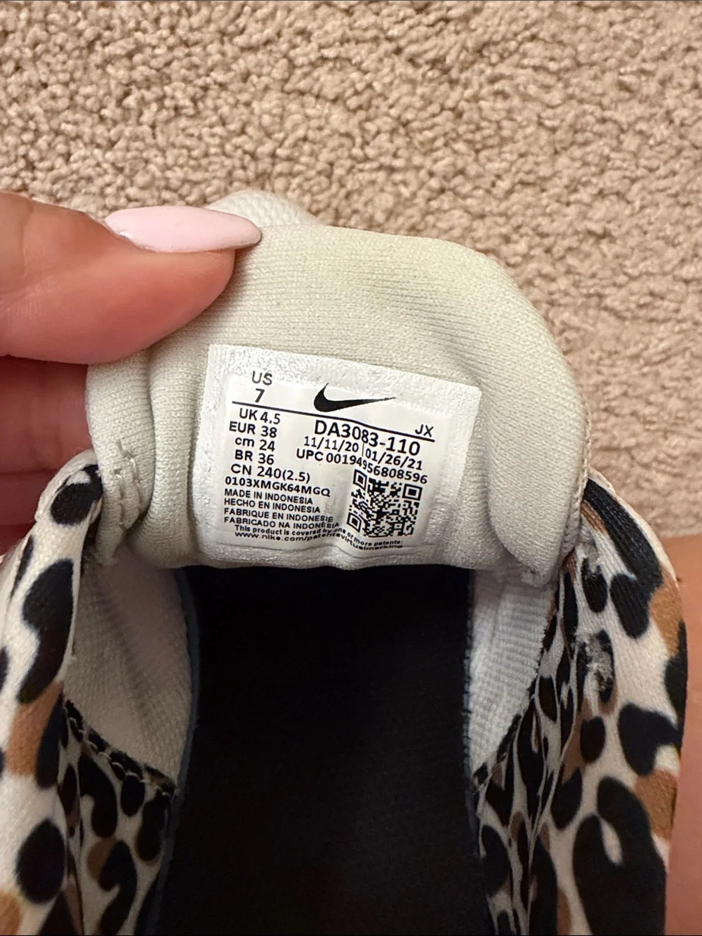 Nike Women's White Athletic Shoes with Leopard Accent